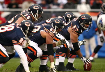 CHICAGO - NOVEMBER 09:  Olin Kreutz #57 of the Chicago Bears centers the ball at the line of scrimmage against the Tennessee Titans at Soldier Field on November 9, 2008 in Chicago, Illinois. The Titans won 21-14. (Photo by Jonathan Ferrey/Getty Images)