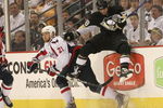 PITTSBURGH - MAY 11: Brooks Laich #21 of the Washington Capitals sidesteps a hit by Kris Letang #58 of the Pittsburgh Penguins during Game Six of the Eastern Conference Semifinal Round of the 2009 Stanley Cup Playoffs at Mellon Arena on May 11, 2009 in Pittsburgh, Pennsylvania. The Capitals defeated the Penguins 5-4 in overtime.  Photo by Bruce Bennett/Getty Images)