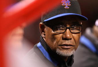 CINCINNATI, OH - APRIL 8: Manager Jerry Manuel of the New York Mets talks with his coaches during their game against the Cincinnati Reds during the inning at Great American Ballpark on April 8, 2009 in Cincinnati, Ohio. (Photo by Mark Lyons/Getty Images)