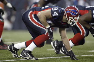 ORCHARD PARK, NY - DECEMBER 17: Aaron Schobel #94 of the Buffalo Bills gets ready at the line of scrimmage during the game against the Miami Dolphins on December 17, 2006 at Ralph Wilson Stadium in Orchard Park, New York. Buffalo won 21-0. (Photo by Rick Stewart/Getty Images)