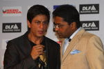 CAPE TOWN, SOUTH AFRICA - APRIL 16:  Lalit Modi (R),  the Chairman of the IPL, and Shah Rukh Khan, the owner of the Kolkata Knight Riders, have a chat at a press conference at the CTICC on April 16, 2009 in Cape Town, South Africa.  (Photo by Tom Shaw/Getty Images)