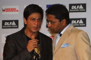 CAPE TOWN, SOUTH AFRICA - APRIL 16:  Lalit Modi (R),  the Chairman of the IPL, and Shah Rukh Khan, the owner of the Kolkata Knight Riders, have a chat at a press conference at the CTICC on April 16, 2009 in Cape Town, South Africa.  (Photo by Tom Shaw/Getty Images)