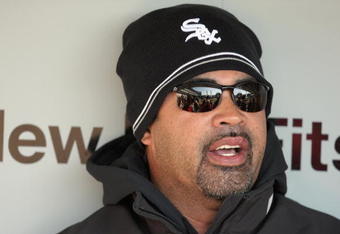 CHICAGO - APRIL 7:  Manager Ozzie Guillen #13 of the Chicago White Sox talks with the press in the dugout before the Opening Day game against the Kansas City Royals on April 7, 2009 at U.S. Cellular Field in Chicago, Illinois. (Photo by Jonathan Daniel/Getty Images) 