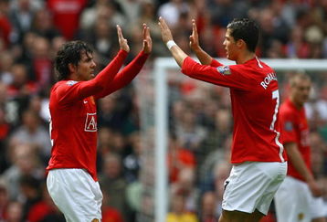 MANCHESTER, ENGLAND - MAY 10:  Cristiano Ronaldo of Manchester United congratulates team mate Carlos Tevez after he scored his team's second goal during the Barclays Premier League match between Manchester United and Manchester City at Old Trafford on May 10, 2009 in Manchester, England.  (Photo by Alex Livesey/Getty Images)