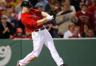 BOSTON - APRIL 24: Jason Bay #44 of the Boston Red Sox hits a two-run home run in the ninth inning to tie the game against the New York Yankees at Fenway Park, April 24, 2009, in Boston, Massachusetts. (Photo by Jim Rogash/Getty Images)