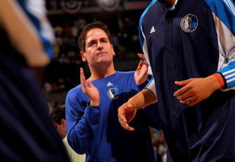 DENVER - MAY 05:  Mark Cuban, owner of the Dallas Mavericks, welcomes his team to the court during player introductions prior to facing the Denver Nuggets in Game Two of the Western Conference Semifinals during the 2009 NBA Playoffs at Pepsi Center on May 5, 2009 in Denver, Colorado. NOTE TO USER: User expressly acknowledges and agrees that, by downloading and or using this photograph, User is consenting to the terms and conditions of the Getty Images License Agreement.  (Photo by Doug Pensinger/Getty Images)