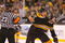 BOSTON - MAY 10: Milan Lucic #17 of the Boston Bruins has to be held back against Carolina Hurricanes the during Game Five of the Eastern Conference Semifinal Round of the 2009 Stanley Cup Playoffs on May 10, 2009 at the TD Banknorth Garden in Boston, Massachusetts. The Bruins won 4-0. (Photo by Jim Rogash/Getty Images)