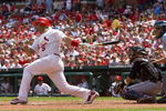 ST. LOUIS, MO - APRIL 23: Albert Pujols #5 of the St. Louis Cardinals hits an RBI single against the New York Mets on April 23, 2009 at Busch Stadium in St. Louis, Missouri. The Cardinals beat the Mets 12-8.  (Photo by Dilip Vishwanat/Getty Images)