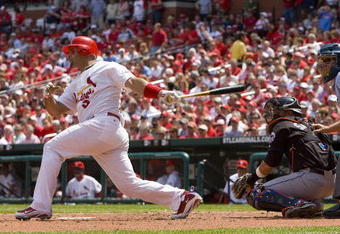 ST. LOUIS, MO - APRIL 23: Albert Pujols #5 of the St. Louis Cardinals hits an RBI single against the New York Mets on April 23, 2009 at Busch Stadium in St. Louis, Missouri. The Cardinals beat the Mets 12-8.  (Photo by Dilip Vishwanat/Getty Images)