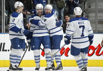 TORONTO - APRIL 11:  Boyd Devereaux #22 of the Toronto Maple Leafs celebrates his 3rd goal of the game with his teammatesin a game against the Ottawa Senators on April 11, 2009 at the Air Canada Centre in Toronto, Ontario. The Leafs defeated the Senators on the strength of a 3 goal performance by Boyd Devereaux #22. (Photo by Claus Andersen/Getty Images)