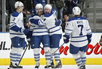 TORONTO - APRIL 11:  Boyd Devereaux #22 of the Toronto Maple Leafs celebrates his 3rd goal of the game with his teammatesin a game against the Ottawa Senators on April 11, 2009 at the Air Canada Centre in Toronto, Ontario. The Leafs defeated the Senators on the strength of a 3 goal performance by Boyd Devereaux #22. (Photo by Claus Andersen/Getty Images)
