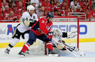 WASHINGTON - MAY 09:  Boyd Gordon #15 of the Washington Capitals tries to stuff a shot on goal between Brooks Orpik #44 and Marc-Andre Fleury #29 of the Pittsburgh Penguins during Game Five of the Eastern Conference Semifinal Round of the 2009 Stanley Cup Playoffs on May 9, 2009 at the Verizon Center in Washington,  DC.  (Photo by Len Redkoles/Getty Images)