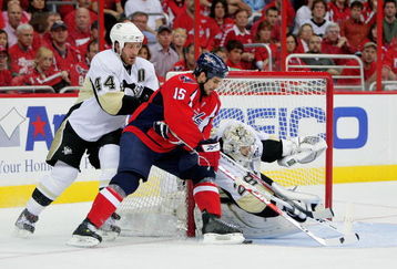 WASHINGTON - MAY 09:  Boyd Gordon #15 of the Washington Capitals tries to stuff a shot on goal between Brooks Orpik #44 and Marc-Andre Fleury #29 of the Pittsburgh Penguins during Game Five of the Eastern Conference Semifinal Round of the 2009 Stanley Cup Playoffs on May 9, 2009 at the Verizon Center in Washington,  DC.  (Photo by Len Redkoles/Getty Images)