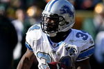 GREEN BAY, WI - DECEMBER 28: Kevin Smith #34 of the Detroit Lions runs for yardage against the Green Bay Packers on December 28, 2008 at Lambeau Field in Green Bay, Wisconsin. The Packers defeated the Lions 31-21. (Photo by Jonathan Daniel/Getty Images)