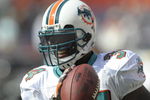 MIAMI, FL - JANUARY 4:  Running back Ricky Williams #34 of the Miami Dolphins grabs a warm up pass before play against the Baltimore Ravens in an NFL Wildcard Playoff Game at Dolphins Stadium on January 4, 2009 in Miami, Florida.  (Photo by Al Messerschmidt/Getty Images) 