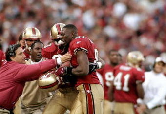3 Jan 1999:  Terrell Owens #81 of the San Francisco 49ers gets helped off the field by J. J. Stokes during the NFC Wild Card Game against the Green Bay Packers at the 3 Comm Park in San Francisco, California. The 49ers defeated the Packers 24-17. Mandatory Credit: Jed Jacobsohn  /Allsport