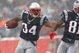 FOXBORO, MA - DECEMBER 21: Randy Moss #81 blocks for teammate Sammy Morris #34 of the New England Patriot against the Arizona Cardinals at Gillette Stadium on December 21, 2008 in Foxboro, Massachusetts. The Patriots won 47-7. (Photo by Jim Rogash/Getty Images)