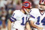 TAMPA, FL - JANUARY 27:  Kicker Scott Norwood #11 and  quarterback Frank Reich #14 of the Buffalo Bills walk n the field during Super Bowl XXV against the New York Giants at Tampa Stadium on January 27, 1991 in Tampa, Florida.  The Giants won 20-19.  (Photo by George Rose/Getty Images)