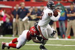ATLANTA - OCTOBER 12:  Desmond Clark #88 of the Chicago Bears carries the ball against Curtis Lofton #50 of the Atlanta Falcons at the Georgia Dome on October 12, 2008 in Atlanta, Georgia.  (Photo by Kevin C. Cox/Getty Images)