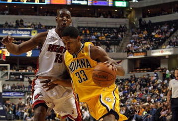 INDIANAPOLIS - NOVEMBER 2:  Danny Granger #33 of the Indiana Pacers dribbles the ball while defended by Mark Blount #15 of the Miami Heat during the NBA game at Conseco Fieldhouse November 2, 2007 in Indianapolis, Indiana. The Pacers won 87-85. NOTE TO USER: User expressly acknowledges and agrees that, by downloading and or using this Photograph, user is consenting to the terms and conditions of the Getty Images License Agreement.  (Photo by Andy Lyons/Getty Images)