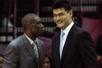HOUSTON - MAY 10:  Center Dikembe Mutombo and Yao Ming of the Houston Rockets during Game Four of the Western Conference Semifinals during the 2009 NBA Playoffs at Toyota Center on May 10, 2009 in Houston, Texas. NOTE TO USER: User expressly acknowledges and agrees that, by downloading and or using this photograph, User is consenting to the terms and conditions of the Getty Images License Agreement.  (Photo by Ronald Martinez/Getty Images)