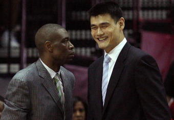 HOUSTON - MAY 10:  Center Dikembe Mutombo and Yao Ming of the Houston Rockets during Game Four of the Western Conference Semifinals during the 2009 NBA Playoffs at Toyota Center on May 10, 2009 in Houston, Texas. NOTE TO USER: User expressly acknowledges and agrees that, by downloading and or using this photograph, User is consenting to the terms and conditions of the Getty Images License Agreement.  (Photo by Ronald Martinez/Getty Images)
