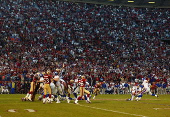 SAN FRANCISCO - JANUARY 5:  Matt Allen #12 of the New York Giants can't handle the low snap on a field goal attempt as time expired against the San Fransisco 49ers in the NFC Wild Card game at 3Com Park on January 5, 2003 in San Francisco, California.  The 49ers' rally was the biggest in NFC playoff history, coming back from a 38-14 hole, to eliminate the Giants from the playoffs with a 39-38 victory.  (Photo by Donald Miralle/Getty Images)