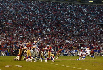 SAN FRANCISCO - JANUARY 5:  Matt Allen #12 of the New York Giants can't handle the low snap on a field goal attempt as time expired against the San Fransisco 49ers in the NFC Wild Card game at 3Com Park on January 5, 2003 in San Francisco, California.  The 49ers' rally was the biggest in NFC playoff history, coming back from a 38-14 hole, to eliminate the Giants from the playoffs with a 39-38 victory.  (Photo by Donald Miralle/Getty Images)