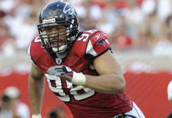 TAMPA, FL - SEPTEMBER 14: Defensive end Jamaal Anderson #98  of the Atlanta Falcons rushes upfield against the Tampa Bay Buccaneers at Raymond James Stadium on September 14, 2008 in Tampa, Florida.  The Buccaneers defeated the Falcons 24-9. (Photo by Al Messerschmidt/Getty Images)
