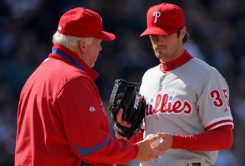 DENVER - APRIL 10:  Starting pitcher Cole Hamels #35 of the Philadelphia Phillies is removed from the game by manager Charlie Manuel #41 after 3 and 2/3 innings against the Colorado Rockies during MLB action on Opening Day at Coors Field on April 10, 2009 in Denver, Colorado. Hamels collected the loss as the Rockies defeated the Phillies 10-3.  (Photo by Doug Pensinger/Getty Images)