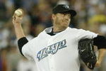 TORONTO - AUGUST 14:  Roy Halladay #32 of the Toronto Blue Jays pitches against the Los Angeles Angels of Anaheim at Rogers Centre on August 14, 2007 in Toronto, Ontario, Canada. The Blue Jays won 4-1. (Photo by Dave Sandford/Getty Images)