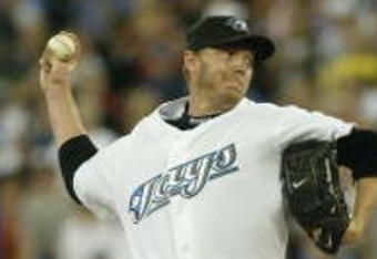 TORONTO - AUGUST 14:  Roy Halladay #32 of the Toronto Blue Jays pitches against the Los Angeles Angels of Anaheim at Rogers Centre on August 14, 2007 in Toronto, Ontario, Canada. The Blue Jays won 4-1. (Photo by Dave Sandford/Getty Images)