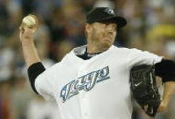 TORONTO - AUGUST 14:  Roy Halladay #32 of the Toronto Blue Jays pitches against the Los Angeles Angels of Anaheim at Rogers Centre on August 14, 2007 in Toronto, Ontario, Canada. The Blue Jays won 4-1. (Photo by Dave Sandford/Getty Images)