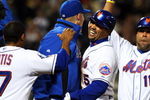 NEW YORK - MAY 12:  Carlos Beltran #15 of the New York Mets celebrates with his teammates after his bases loaded base on ball in the tenth inning against the Atlanta Braves at Citi Field May 12, 2009 in the Flushing neighborhood of the Queens borough of New York City. The Mets defeated the Braves 4-3 in ten innings.  (Photo by Jim McIsaac/Getty Images)