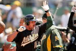 OAKLAND, CA - MAY 09:  Jason Giambi #16 of the Oakland Athletics is congratulated by teammates after he hit his first of two home runs against the Toronto Blue Jays on May 9, 2009 at the Oakland Coliseum in Oakland, California.  (Photo by Ezra Shaw/Getty Images)