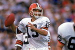 LOS ANGELES - NOVEMBER 16:  Quarterback Bernie Kosar #19 of the Cleveland Browns looks for a receiver during a game against the Los Angeles Raiders at the Los Angeles Memorial Coliseum on November 16, 1986 in Los Angeles, California.  The Raiders won 27-14.  (Photo by George Rose/Getty Images)