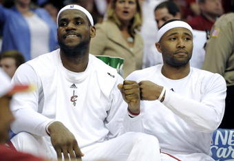 CLEVELAND - MAY 07:  LeBron James #23 of the Cleveland Cavaliers celebrates with Mo Williams #2 on the bench while playing the Atlanta Hawks in Game Two of the Eastern Conference Semifinals during the 2009 NBA Playoffs at Quicken Loans Arena on May 7, 2009 in Cleveland, Ohio. Cleveland won the game 105-85 to take a 2-0 series lead. NOTE TO USER: User expressly acknowledges and agrees that, by downloading and or using this photograph, User is consenting to the terms and conditions of the Getty Images License Agreement.  (Photo by Gregory Shamus/Getty Images)