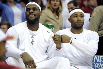 CLEVELAND - MAY 07:  LeBron James #23 of the Cleveland Cavaliers celebrates with Mo Williams #2 on the bench while playing the Atlanta Hawks in Game Two of the Eastern Conference Semifinals during the 2009 NBA Playoffs at Quicken Loans Arena on May 7, 2009 in Cleveland, Ohio. Cleveland won the game 105-85 to take a 2-0 series lead. NOTE TO USER: User expressly acknowledges and agrees that, by downloading and or using this photograph, User is consenting to the terms and conditions of the Getty Images License Agreement.  (Photo by Gregory Shamus/Getty Images)