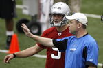 ALLEN PARK, MI - MAY 01: Offensive coordinator Scott Linehan of the Detroit Lions talks with Matthew Stafford #9 during rookie orientation camp at the Detroit Lions Headquarters and Training Facility on May 1, 2009 in Allen Park, Michigan.  (Photo by Gregory Shamus/Getty Images)