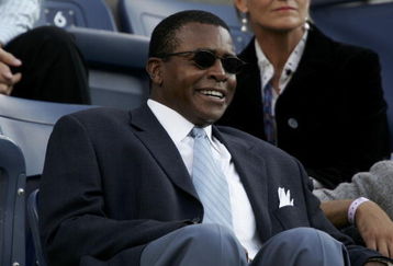 NEW YORK - SEPTEMBER 11: Sportscaster Ahmad Rashad watches the men's final between Andre Agassi and Roger Federer of Switzerland at the US Open at the USTA National Tennis Center in Flushing Meadows Corona Park on September 11, 2005 in the Flushing neighborhood of the Queens borough of New York.  (Photo by Al Bello/Getty Images)