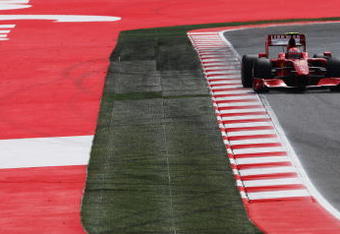 BARCELONA, SPAIN - MAY 09:  Kimi Raikkonen of Finland and Ferrari drives during qualifying for the Spanish Formula One Grand Prix at the Circuit de Catalunya on May 9, 2009 in Barcelona, Spain.  (Photo by Clive Mason/Getty Images)
