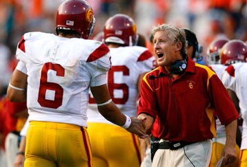 CHARLOTTESVILLE, VA - AUGUST 30:  Head coach Pete Carroll (R) congratulates uarterback Mark Sanchez #6 of the Southern California Trojans after another touchdown in their 52-7 win over the Virginia Cavaliers during the game at Scott Stadium on August 30, 2008 in Charlottesville, Virginia.  (Photo by Kevin C. Cox/Getty Images)