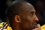 LOS ANGELES, CA - MAY 12:  Kobe Bryant #24 of the Los Angeles Lakers smiles on the bench late in the fourth quarter against the Houston Rockets in Game Five of the Western Conference Semifinals during the 2009 NBA Playoffs at Staples Center on May 12, 2009 in Los Angeles, California. NOTE TO USER: User expressly acknowledges and agrees that, by downloading and or using this photograph, User is consenting to the terms and conditions of the Getty Images License Agreement.  (Photo by Stephen Dunn/Getty Images)
