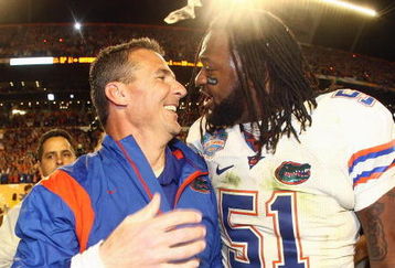 MIAMI - JANUARY 08:  Head coach Urban Meyer of the Florida Gators celebrates with Brandon Spikes #51 their win over the Oklahoma Sooners after the FedEx BCS National Championship Game at Dolphin Stadium on January 8, 2009 in Miami, Florida.  (Photo by Donald Miralle/Getty Images)