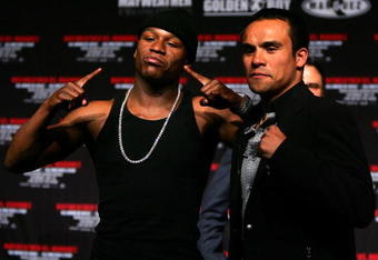 LAS VEGAS - MAY 02:  (L-R) Boxer Floyd Mayweather Jr. poses with boxer Juan Manuel Marquez of Mexico during a news conference announcing the return of Mayweather Jr. to the ring and his upcoming fight against Marquez on July 18 during the news conference at the Hollywood Theatre in the MGM Grand Hotel/Casino May 2, 2009 in Las Vegas, Nevada.  (Photo by Al Bello/Getty Images)