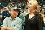 388221 01: FILE PHOTO: Singer Jimmy Buffett talks to Sylvester Stallone's wife Jennifer Flavin before game one of the NBA playoffs at the Miami Arena as the New York Knicks take on the Miami Heat April 25, 1998 in Miami, FL. Buffett was nominated by Florida Atlantic University faculty members April 24, 2001 to become part of the school's board of trustees. (Photo by Daniel LeClaire/Newsmakers)