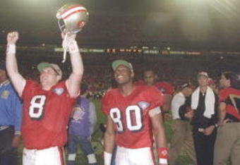 29 Jan 1995:  Quarterback Steve Young #8 and wide receiver Jerry Rice #80 of the San Francisco 49ers cheer after victory over the San Diego Chargers at Super Bowl XXIX at the Joe Robbie Stadium in Miami, Florida.  The 49ers won 49-26. Mandatory Credit: Si