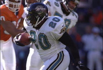 4 Jan 1997:  Running back Natrone Means of the Jacksonville Jaguars moves the ball during a playoff game against the Denver Broncos at Mile High Stadium in Denver, Colorado.  The Jaguars won the game, 30-27. Mandatory Credit: Jamie Squire  /Allsport