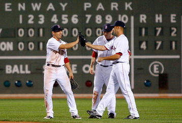 BOSTON - APRIL 26: Jacoby Ellsbury #46, J.D. Drew #7, and Jonathan Van Every of the Boston Red Sox celebrate a 4-1 win against the New York Yankees at Fenway Park April 26, 2009 in Boston, Massachusetts. (Photo by Jim Rogash/Getty Images)