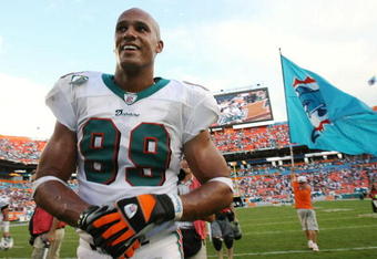 MIAMI - DECEMBER 16:  Defensive end Jason Taylor #99 of the Miami Dolphins celebrates after defeating the Baltimore Ravens at Dolphin Stadium December 16, 2007 in Miami, Florida. The Dolphins defeated the Ravens 22-16 for their first victory of the year.  (Photo by Doug Benc/Getty Images)